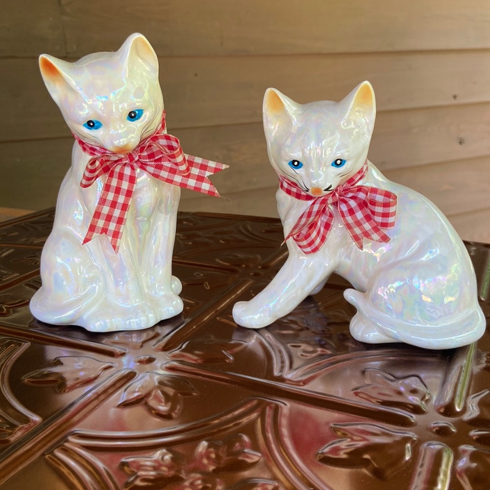 White vintage iridescent Cat figurines with repairs & some cracks if look close.